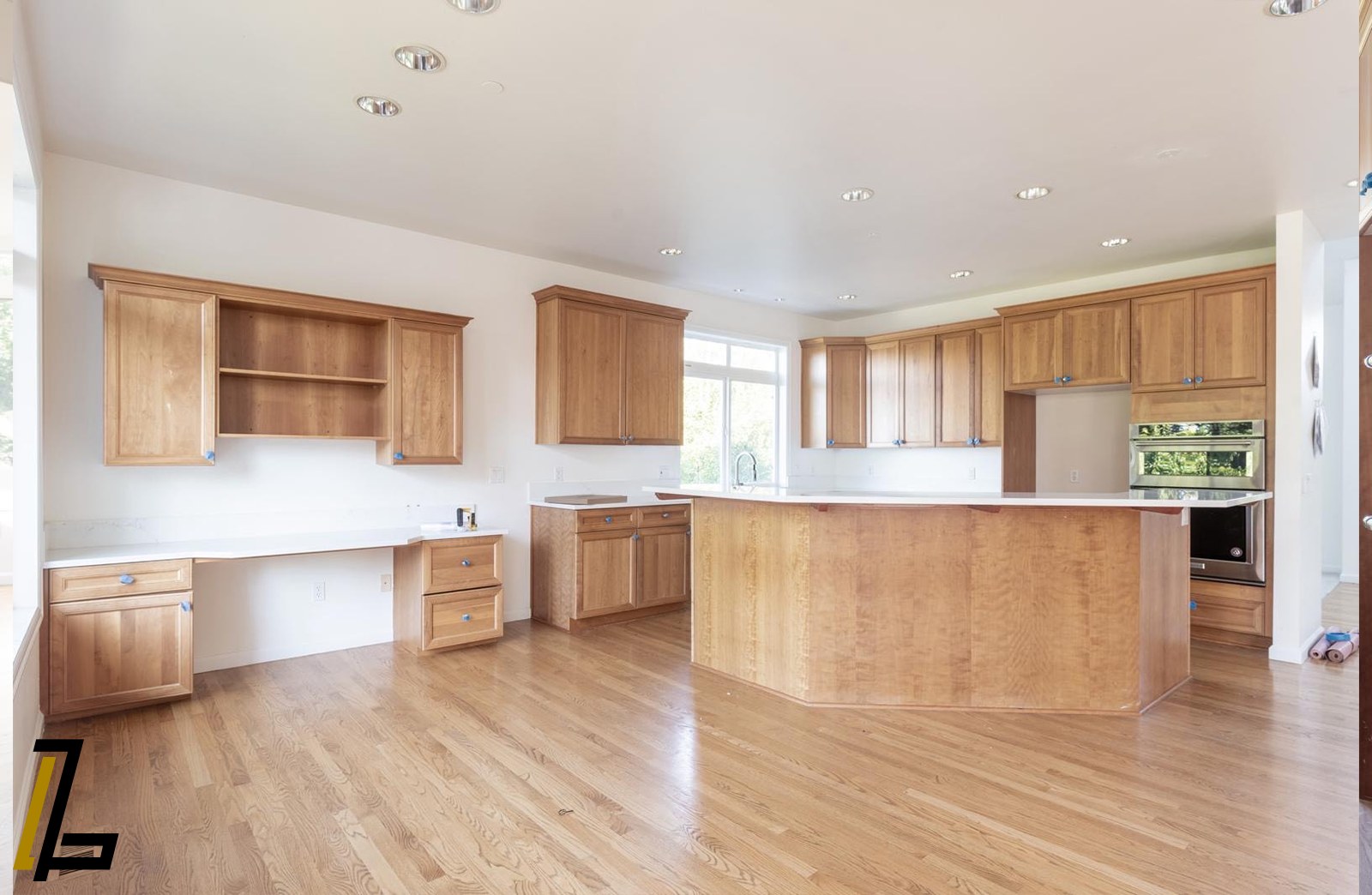Original kitchen with dated oak cabinets